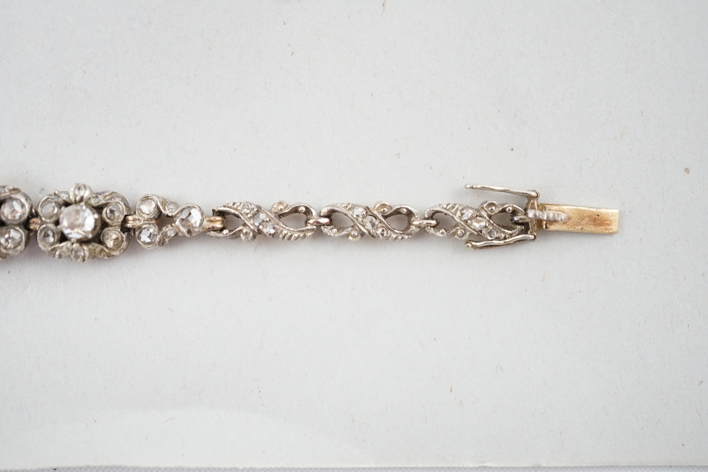 An early 20th century continental 14k gold and rose cut diamond cluster set bracelet